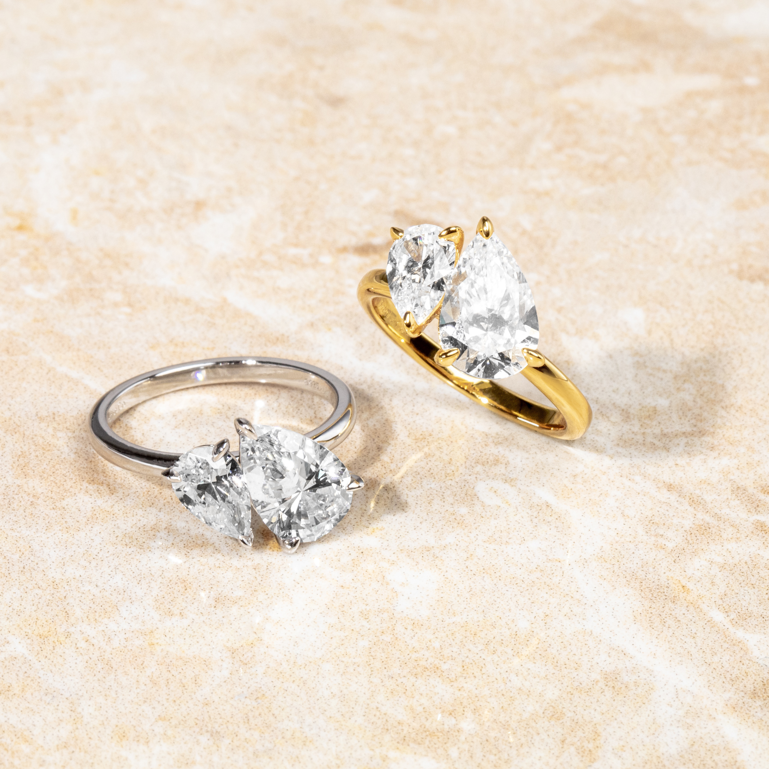 Close-up of pear cut toi et moi ring in gold – delicate handcrafted affordable ring jewellery