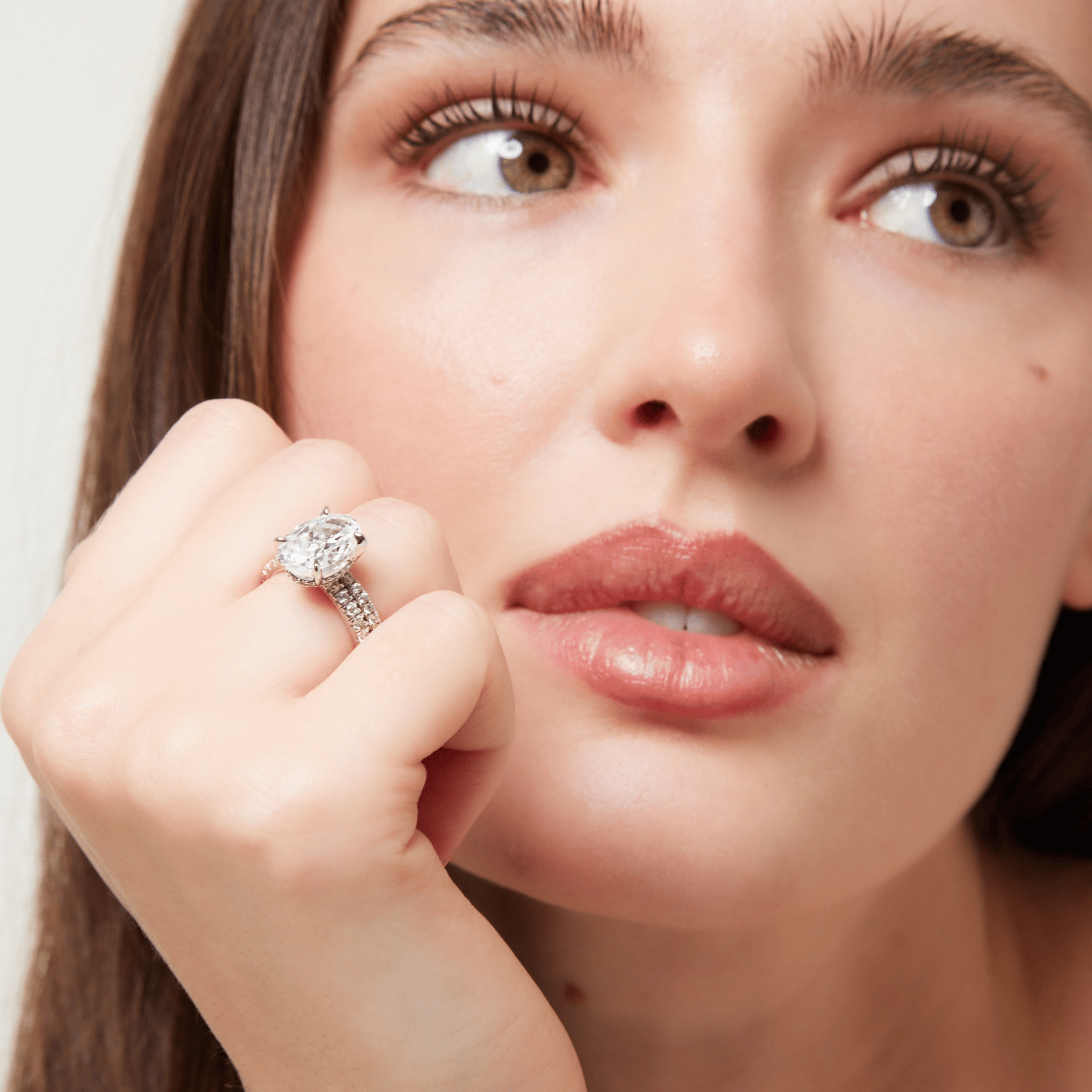 Side profile of Promise Sparkle Oval Ring with hidden halo and half pavé sparkle band - elegant affordable luxury for engagement, promise or wedding