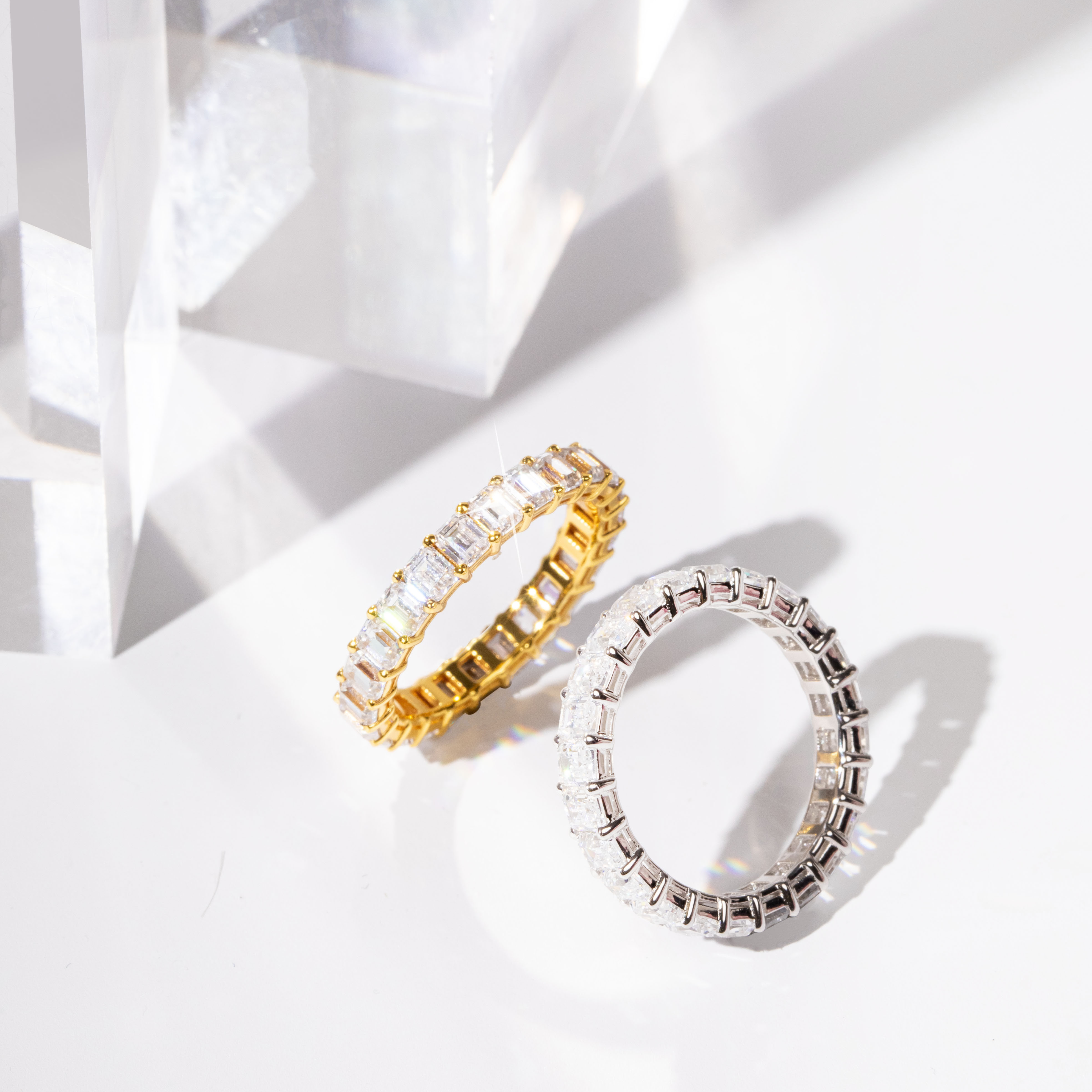 Emerald cut eternity band worn on finger – a sophisticated and affordable luxury promise ring.