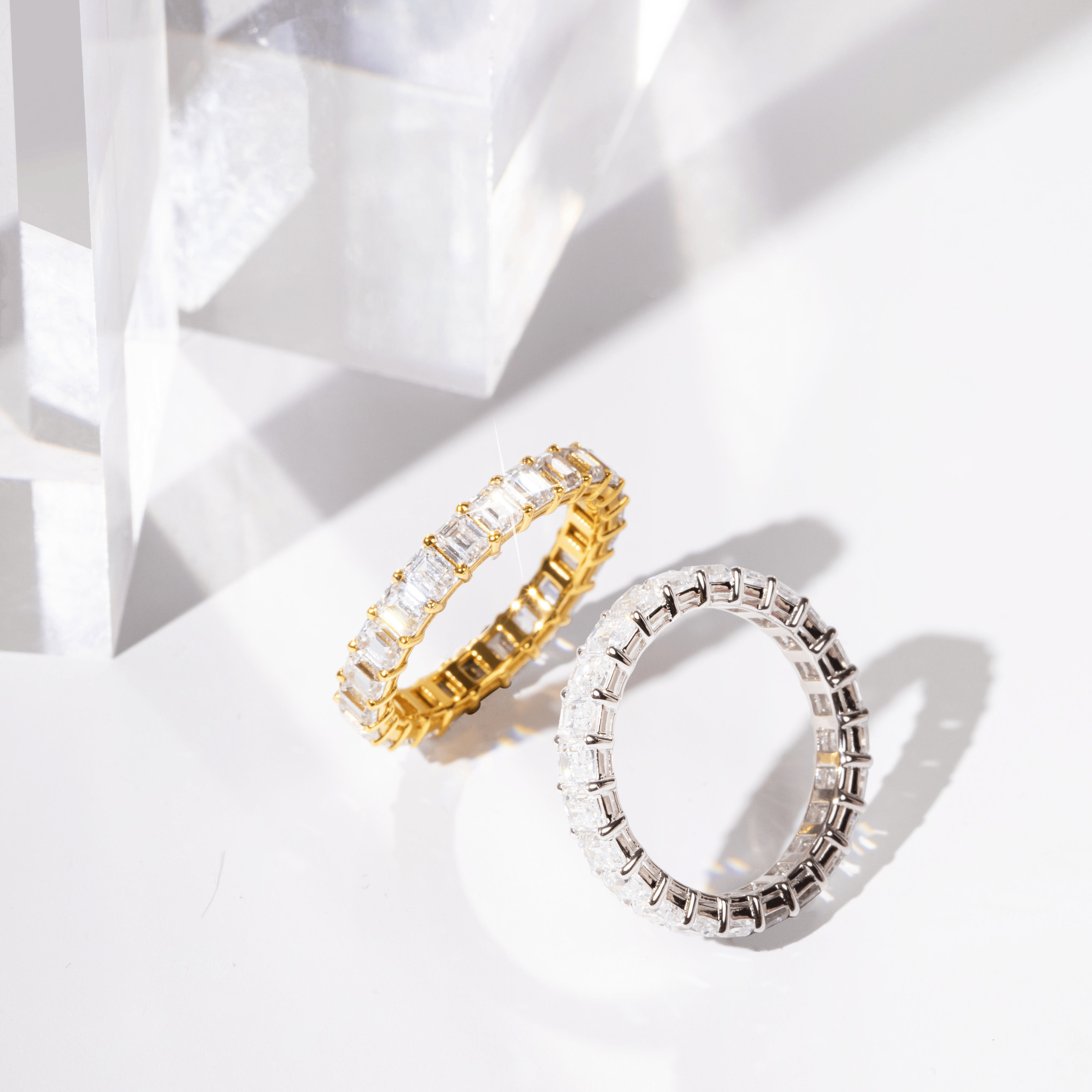 Emerald cut eternity band worn on finger – a sophisticated and affordable luxury promise ring.