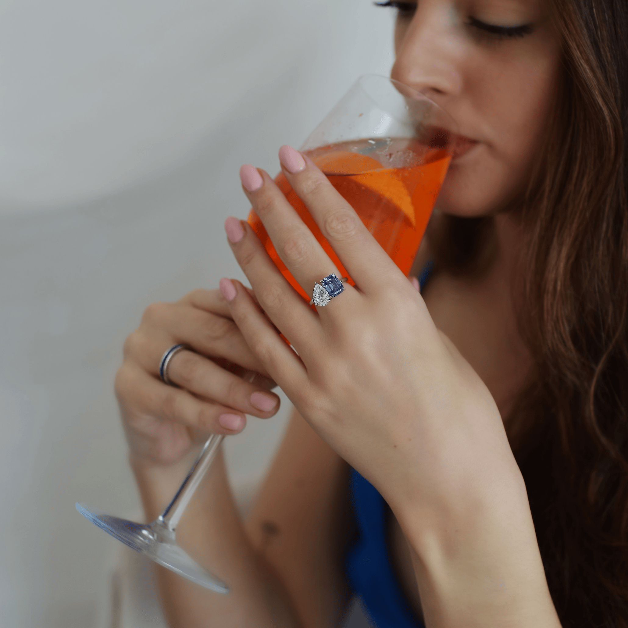 The Promise Ring Co. Blue Toi et Moi diamond simulant ring. Featuring a Cornflower Blue Radiant cut and a Diamond simulant leaning Pear Stone. Shop in Sterling Silver.