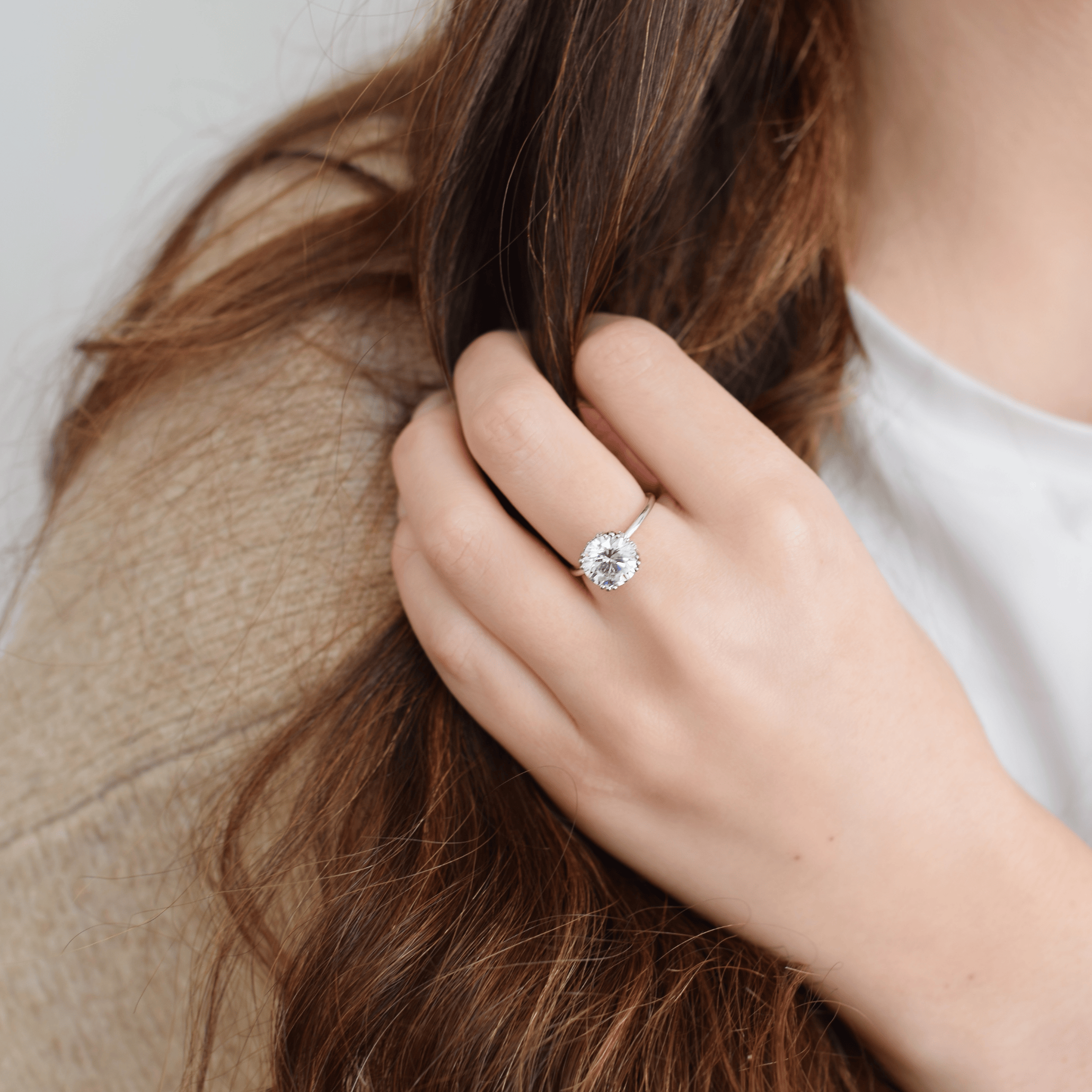 The Promise Ring Co. Circle Solitaire diamond simulant ring. Unique hidden halo. Shop in 18ct Gold or Sterling Silver.