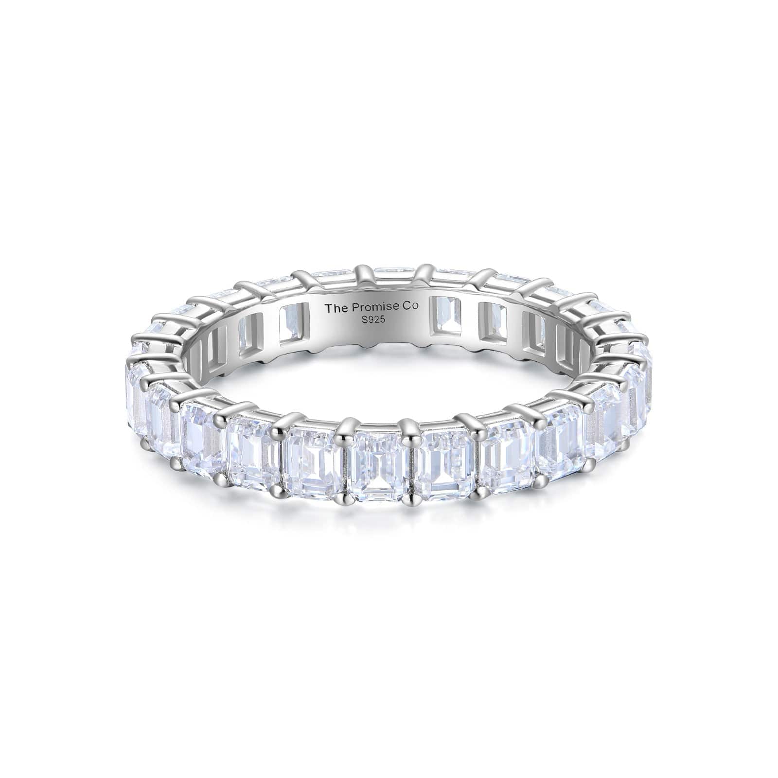 Emerald cut eternity band stacked with other rings – versatile as a wedding band or unique promise ring