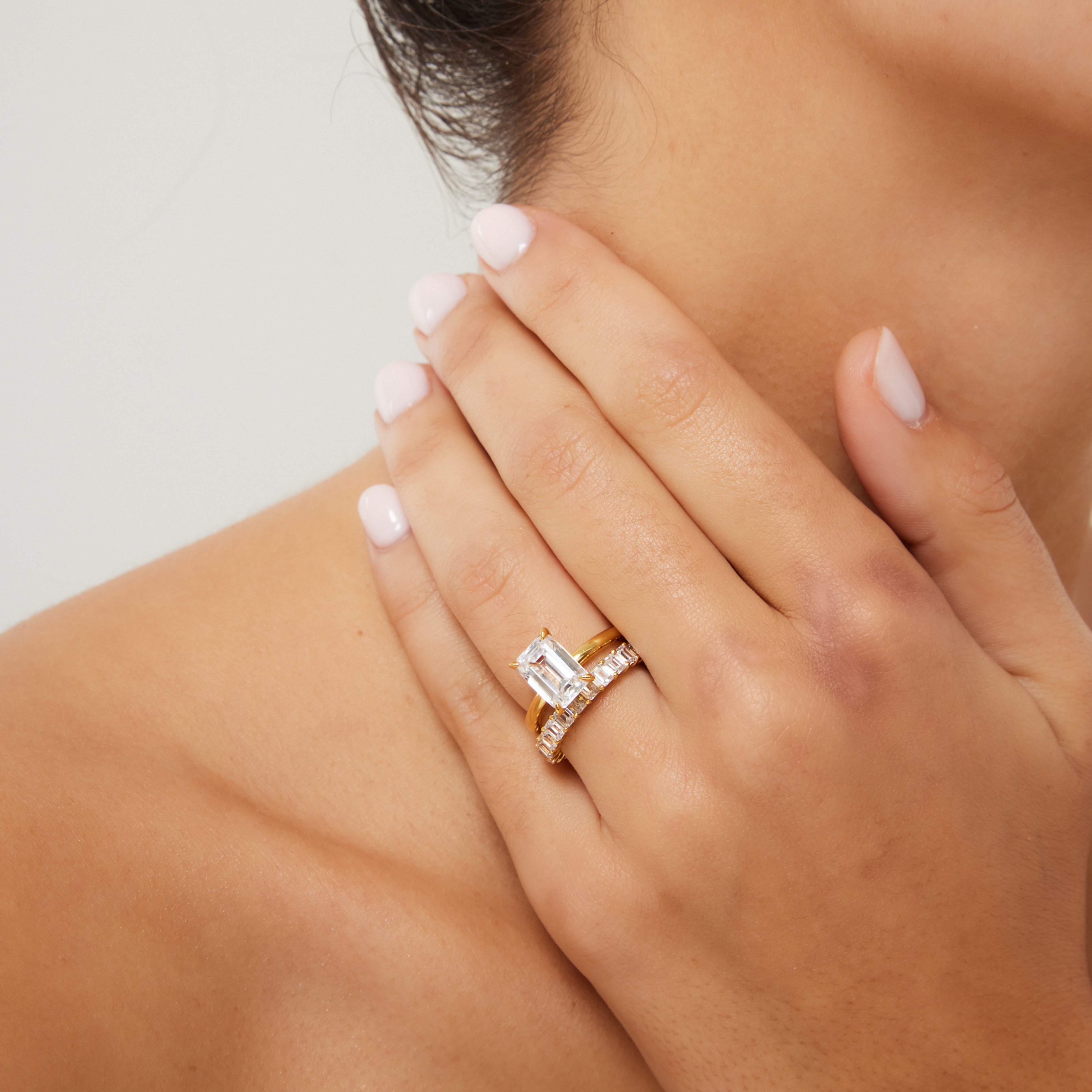 18ct gold solitaire emerald cut stacked on emerald cut band gifts she will love