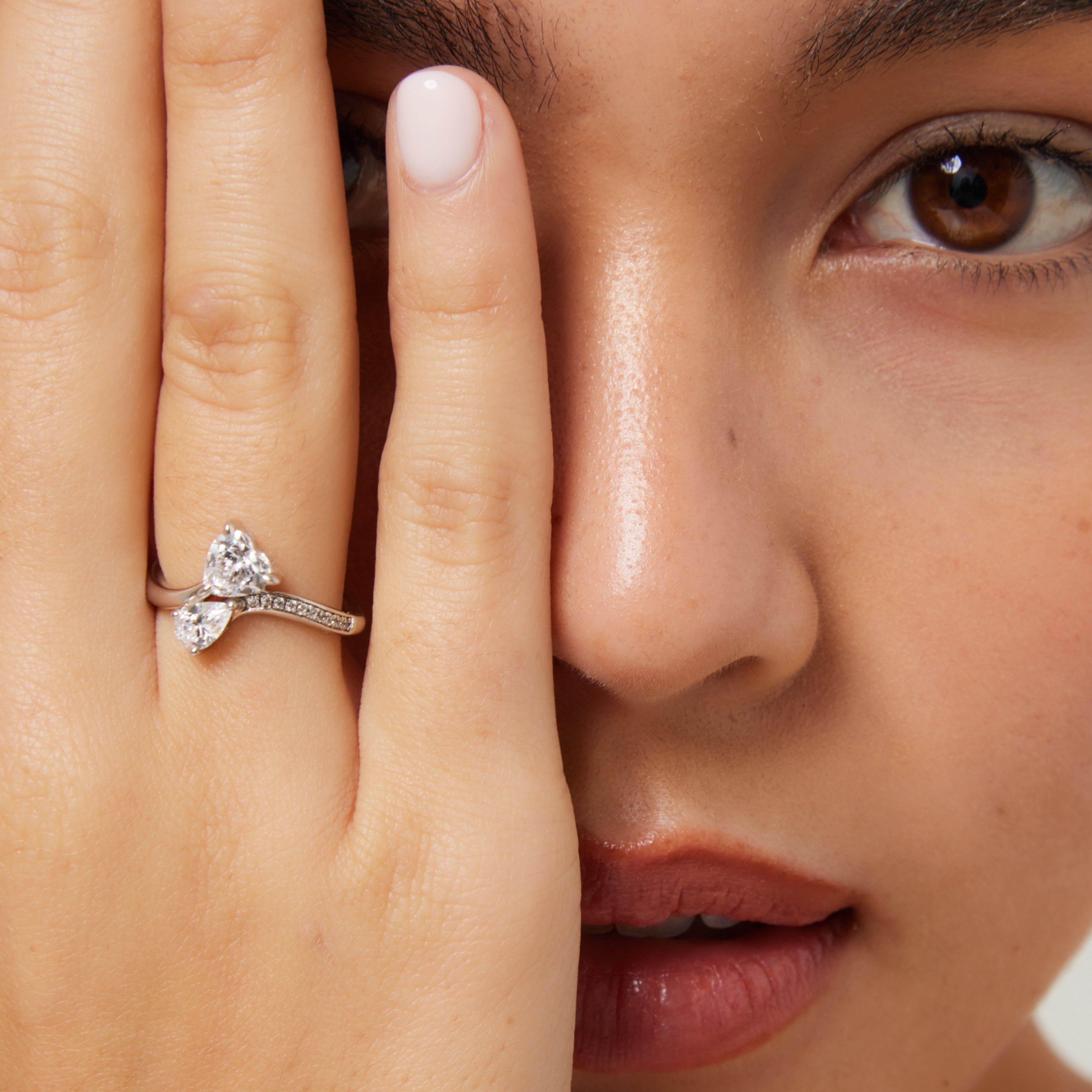 Close-up of heart and pear stones in Toi et Moi setting - a beautifully crafted women’s promise ring by The Promise Co.