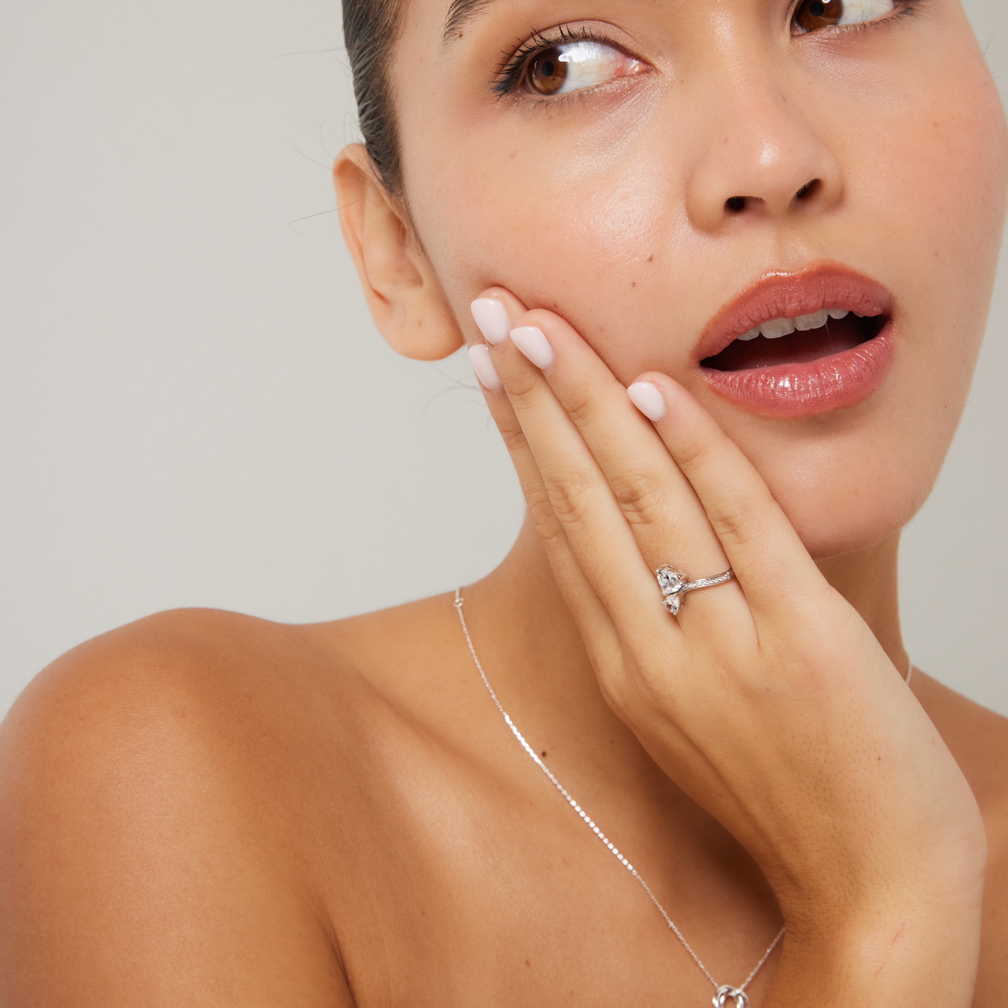 Close-up of heart and pear stones in Toi et Moi setting a beautifully crafted women’s promise ring by The Promise Co.